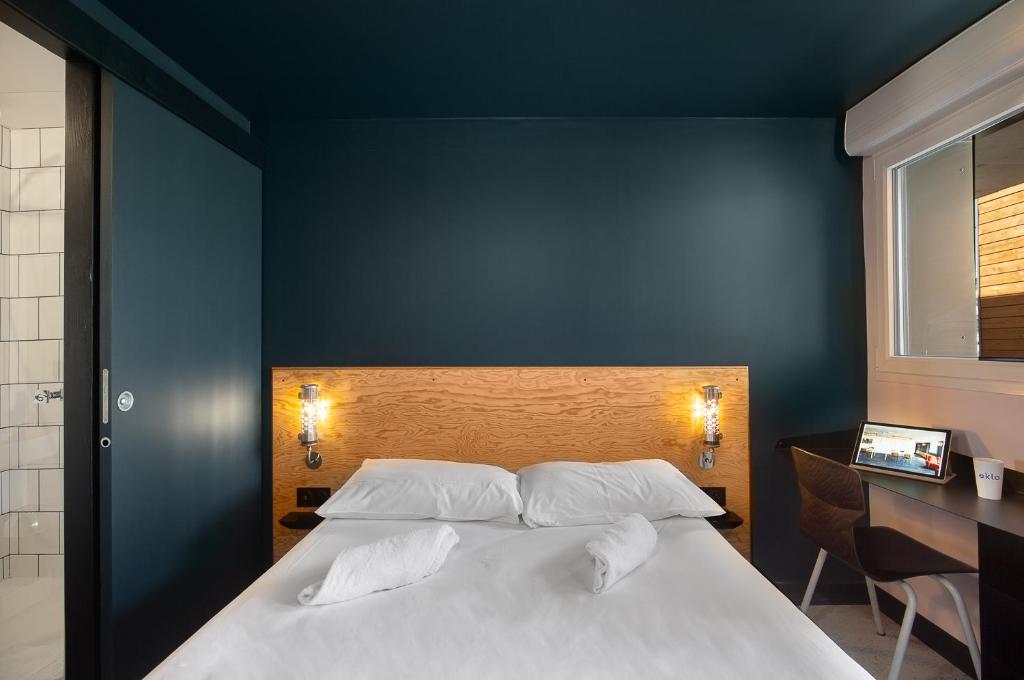 Postel nebo postele na pokoji v ubytování Eklo Bordeaux Centre Bastide