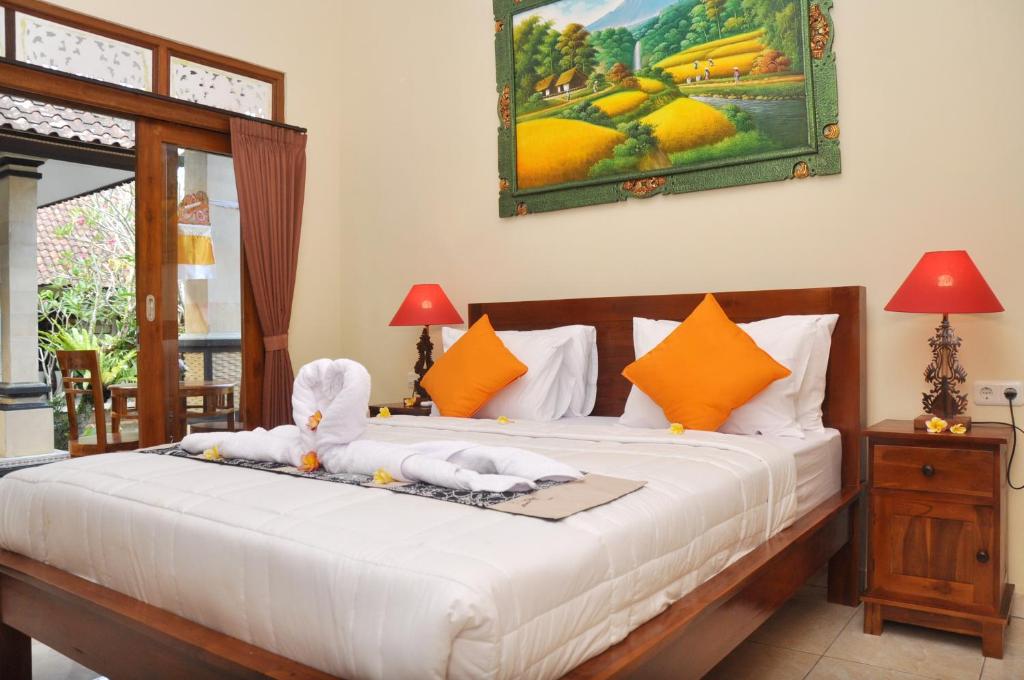 Postel nebo postele na pokoji v ubytování Dunung Sari Homestay