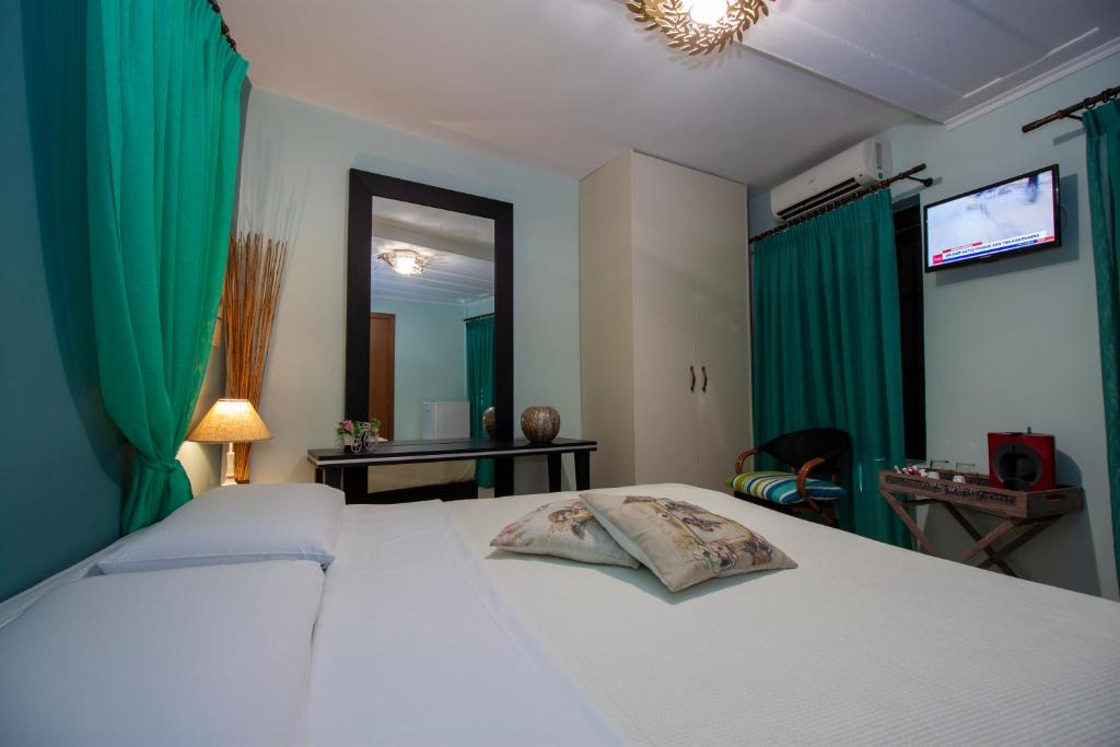 Postel nebo postele na pokoji v ubytování Elia Portou Rooms