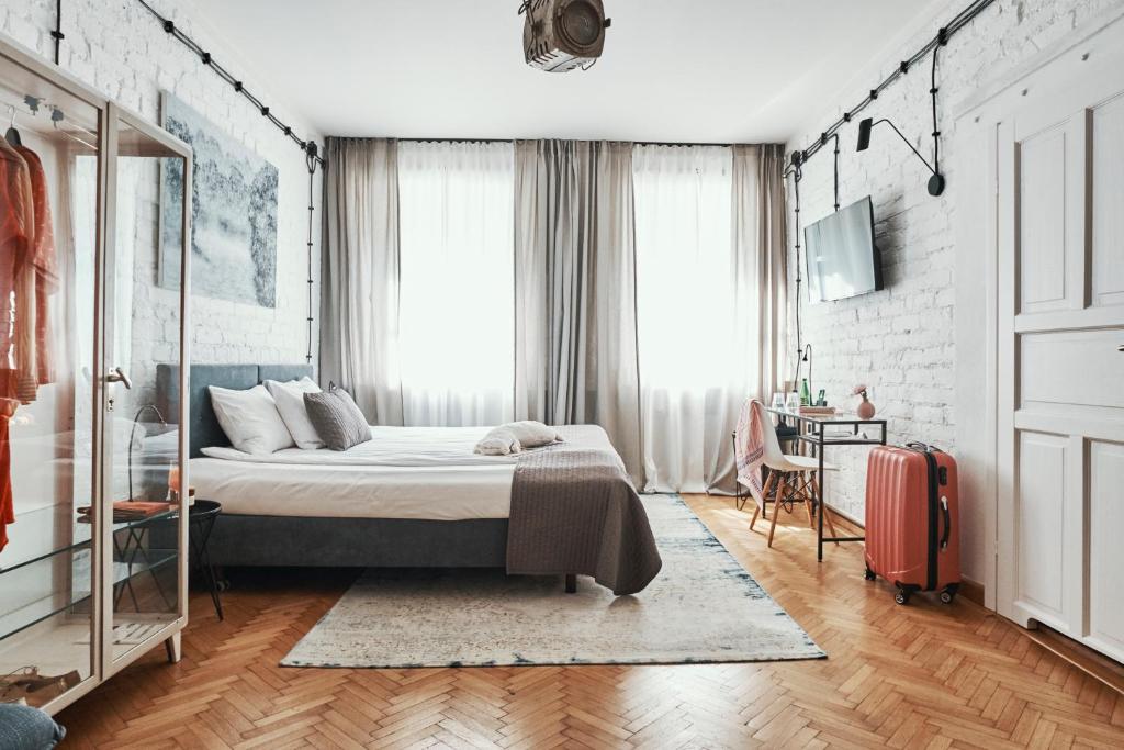 Posteľ alebo postele v izbe v ubytovaní ARTHOTEL STALOWA 52