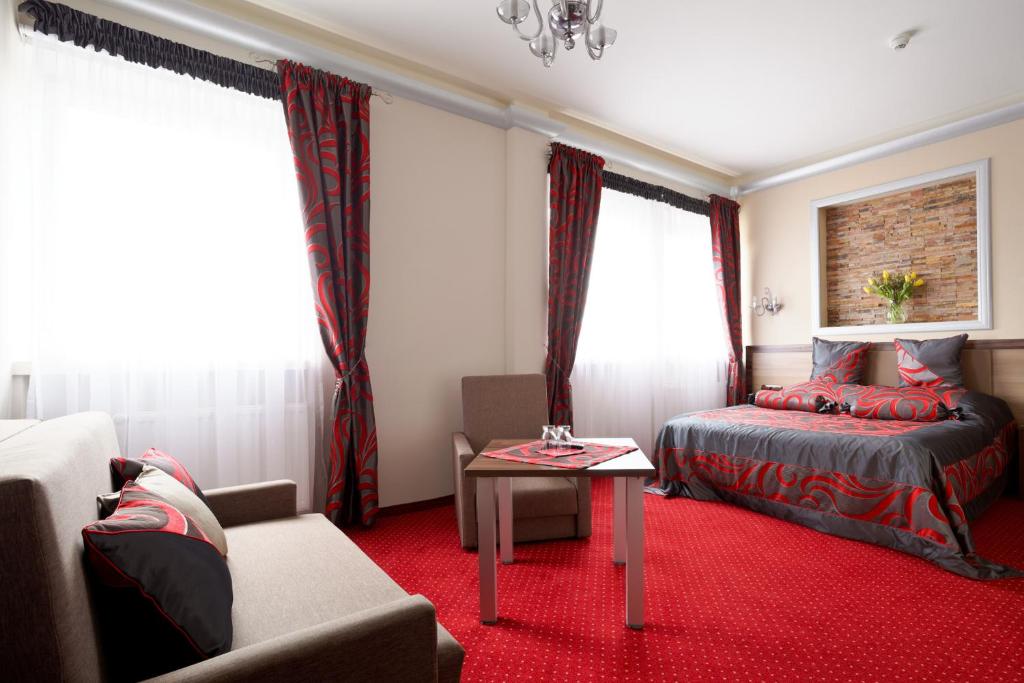 Postel nebo postele na pokoji v ubytování Hotel Politański