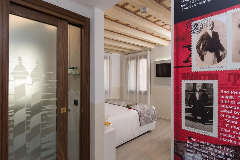 Postel nebo postele na pokoji v ubytování UNAHOTELS Ala Venezia-Adults 16