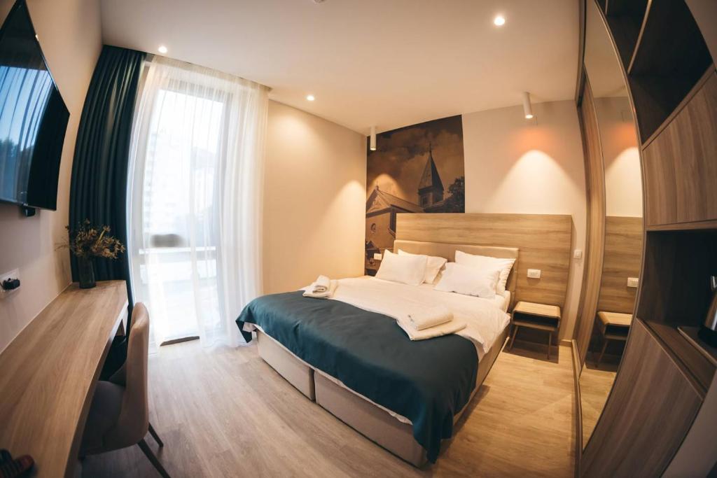 Postel nebo postele na pokoji v ubytování Hotel Verso
