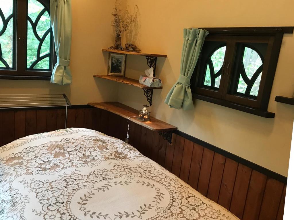 Postel nebo postele na pokoji v ubytování Garden Shed R