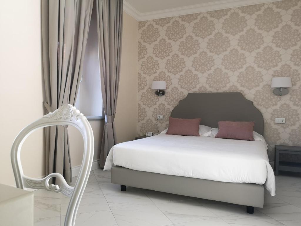 Postel nebo postele na pokoji v ubytování Hotel Altavilla Catanzaro
