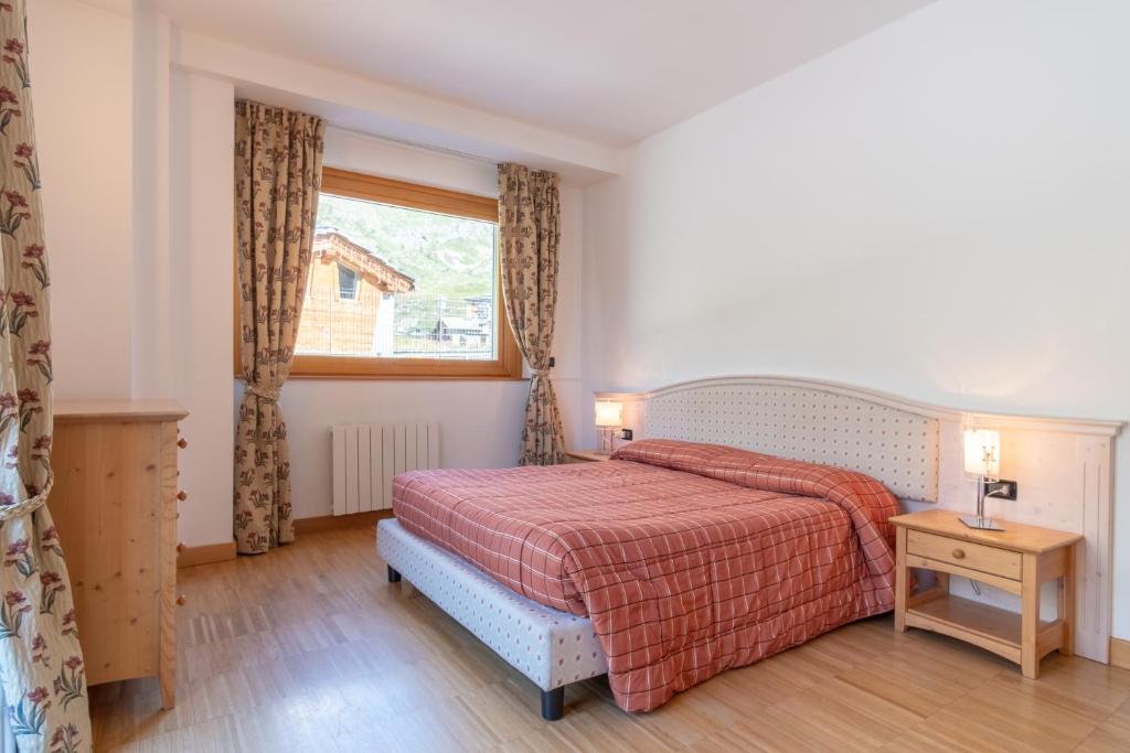 Posteľ alebo postele v izbe v ubytovaní Monte Cervino Apartment AS21