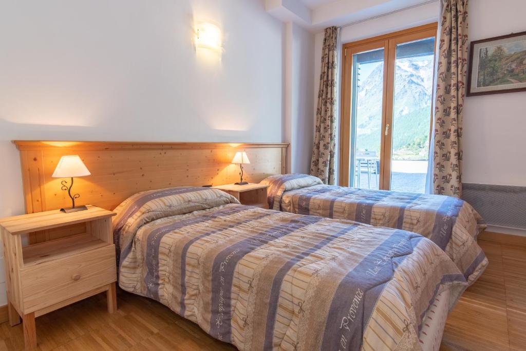 Posteľ alebo postele v izbe v ubytovaní Monte Cervino Apartment AS21
