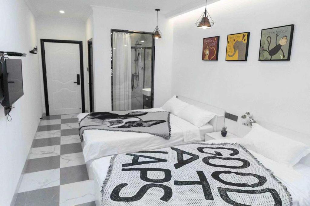 Postel nebo postele na pokoji v ubytování Xiamen Guiran Hostel
