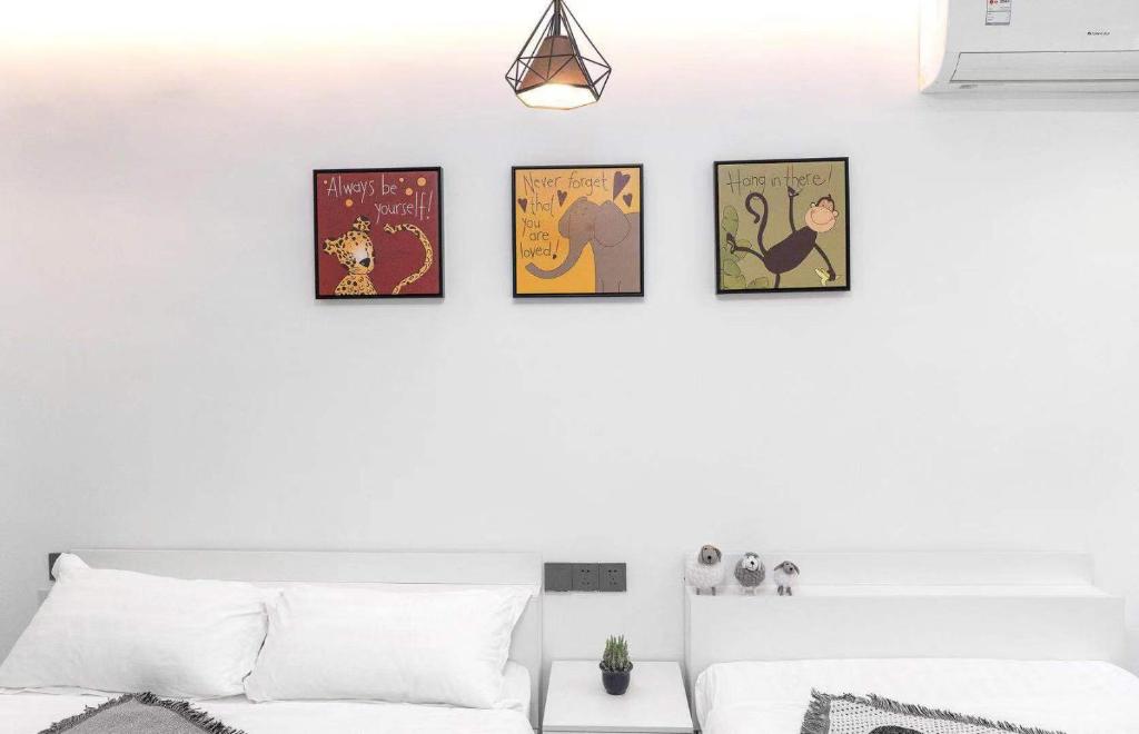 Postel nebo postele na pokoji v ubytování Xiamen Guiran Hostel