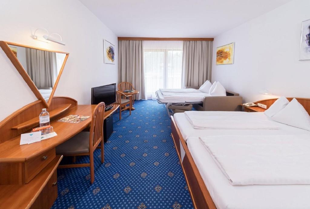 Postel nebo postele na pokoji v ubytování Terrassenhotel Reichmann