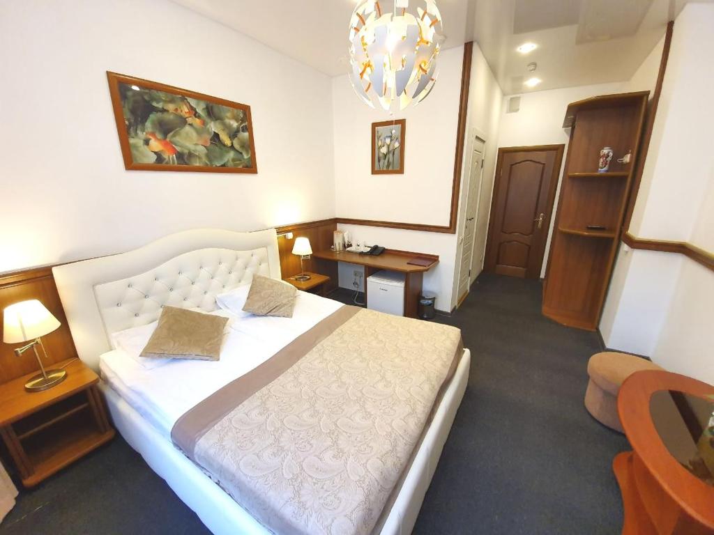 Кровать или кровати в номере Krasny Terem Hotel