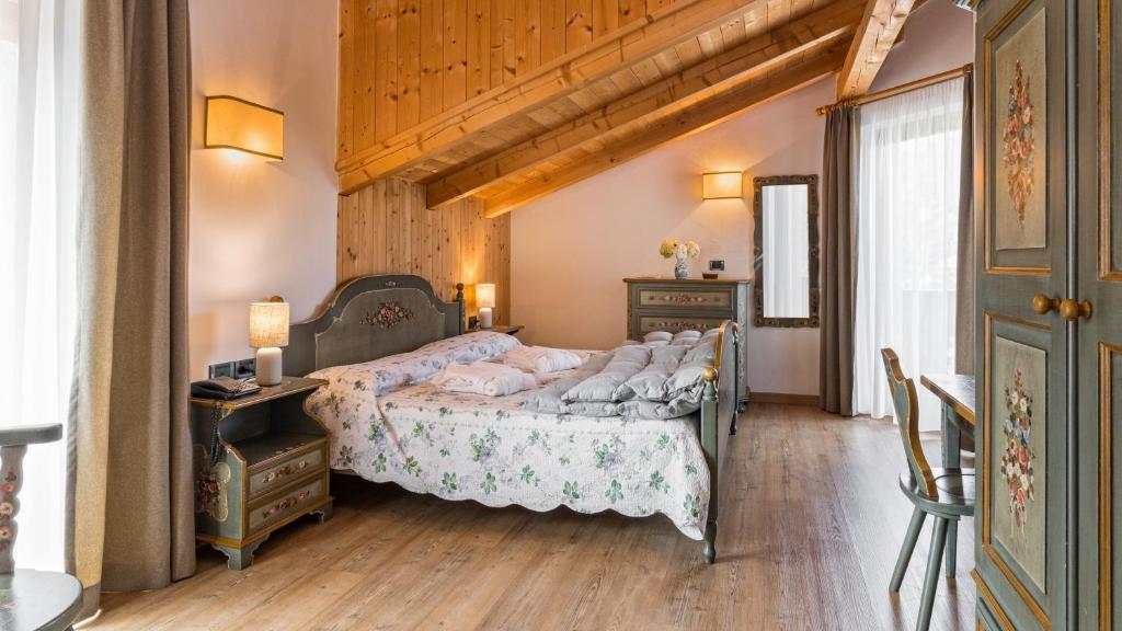 Postel nebo postele na pokoji v ubytování Hotel Brunella