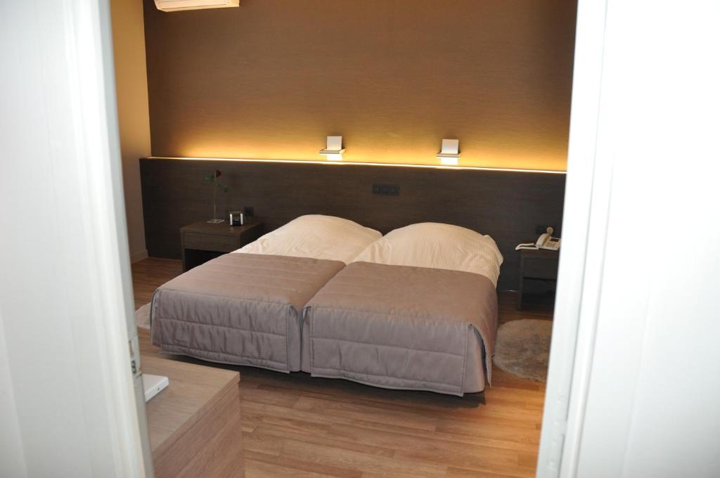 Postel nebo postele na pokoji v ubytování Hotel De Zalm