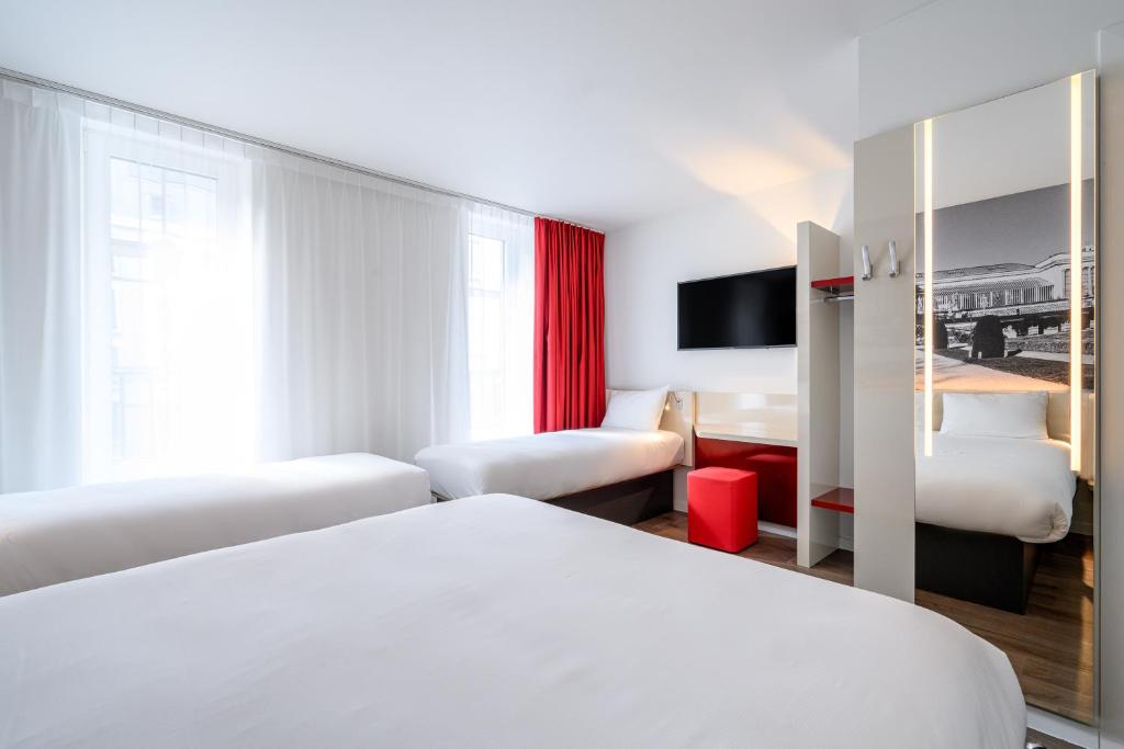 Postel nebo postele na pokoji v ubytování B&B HOTEL Brussels Centre Gare du Midi