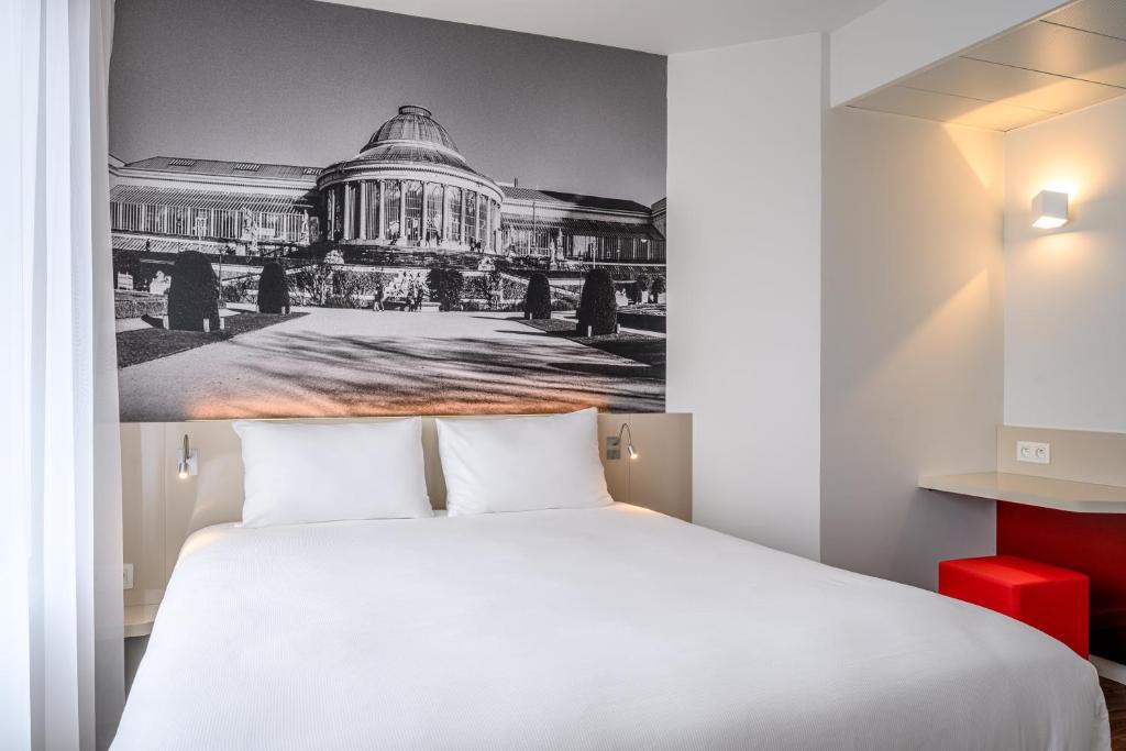 Postel nebo postele na pokoji v ubytování B&B HOTEL Brussels Centre Gare du Midi