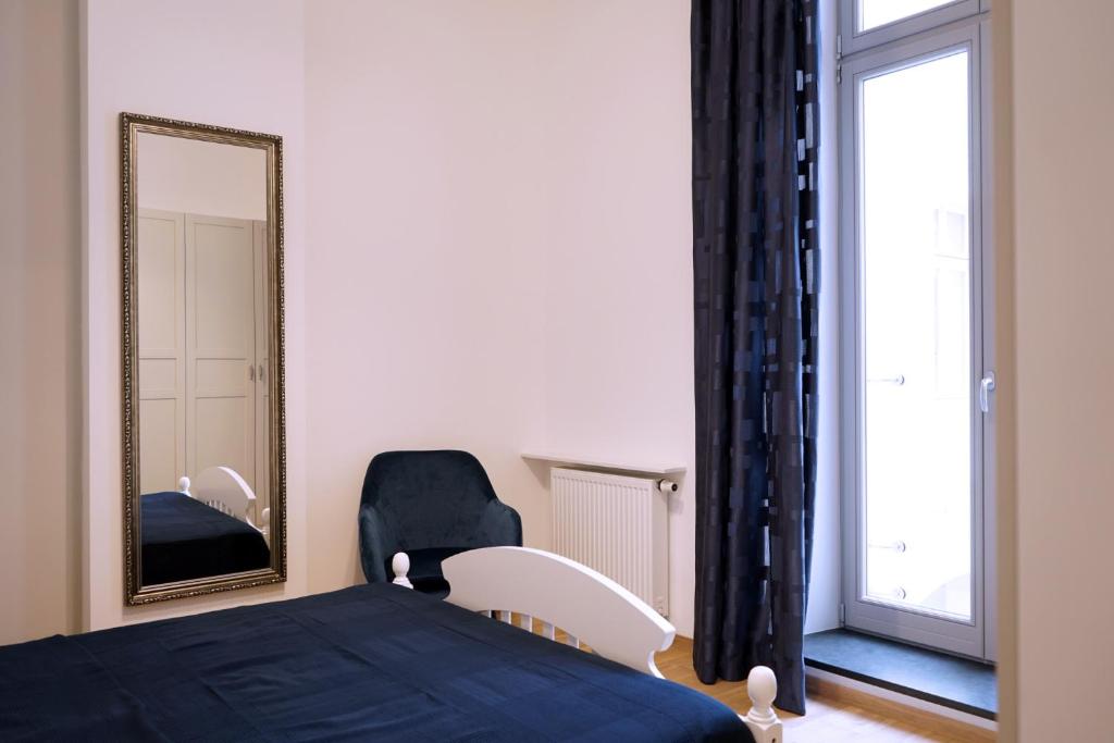 Posteľ alebo postele v izbe v ubytovaní Sienkiewicza Loft1
