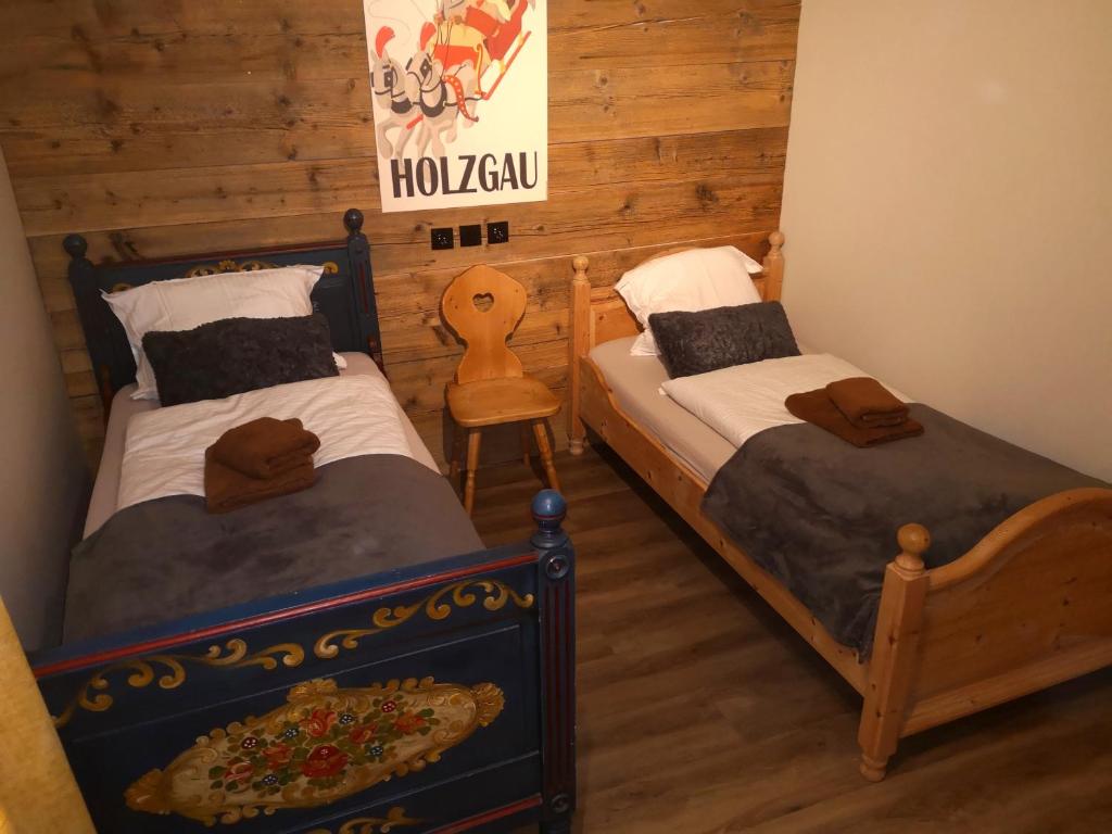 Posteľ alebo postele v izbe v ubytovaní De nussi's chalet 3