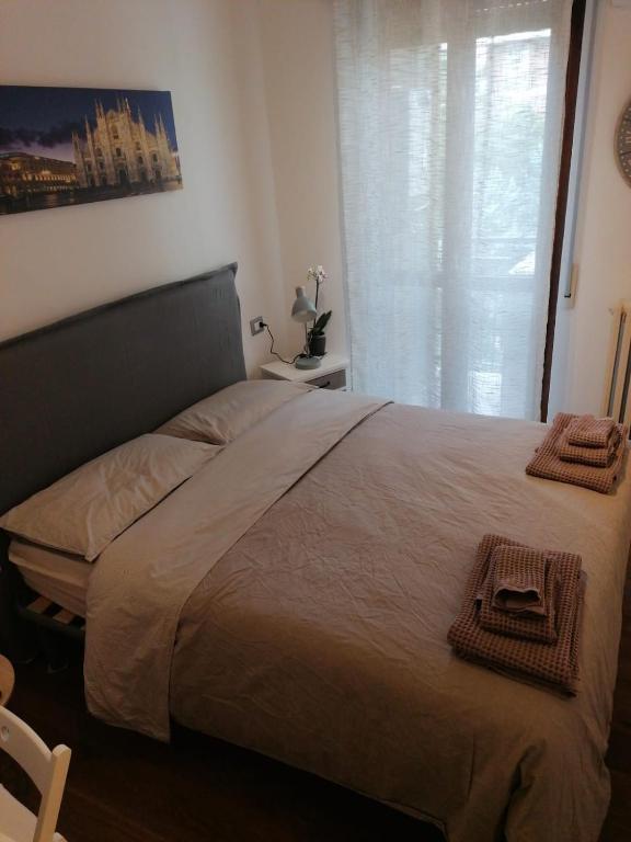 A bed or beds in a room at Welcome Home