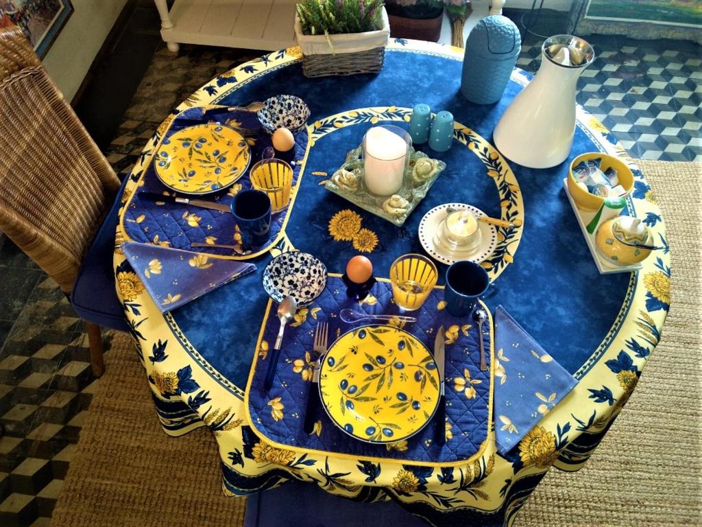 a blue table with plates and dishes on it at 'de Spiering' Leende in Leende
