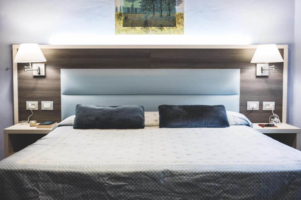 Posteľ alebo postele v izbe v ubytovaní Hotel Il Giardino