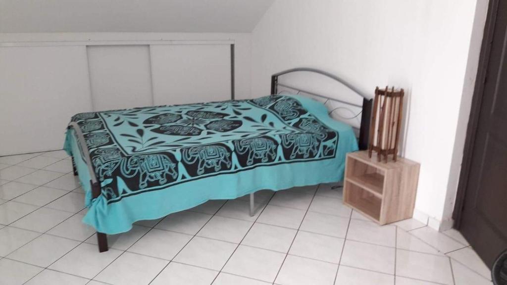 Postel nebo postele na pokoji v ubytování lakazadom974 - Chambres d'Hôtes