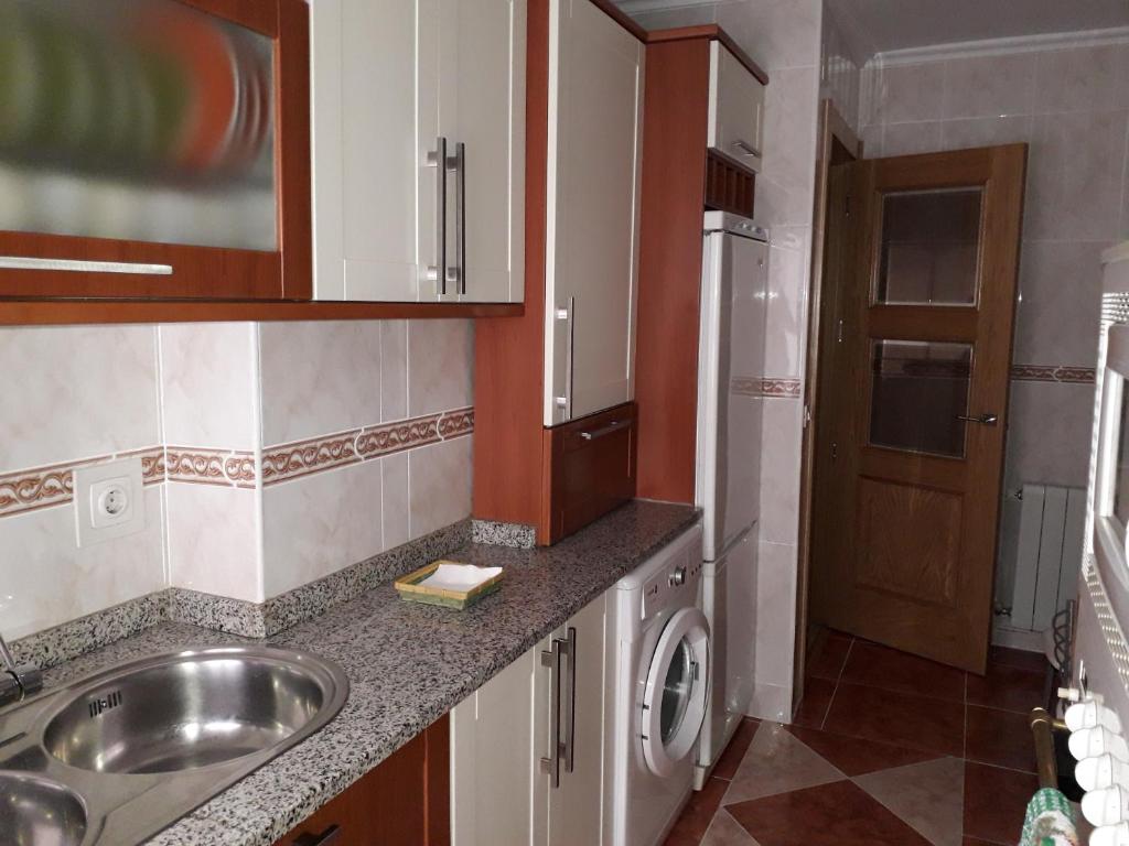 Kuchyň nebo kuchyňský kout v ubytování Piso María
