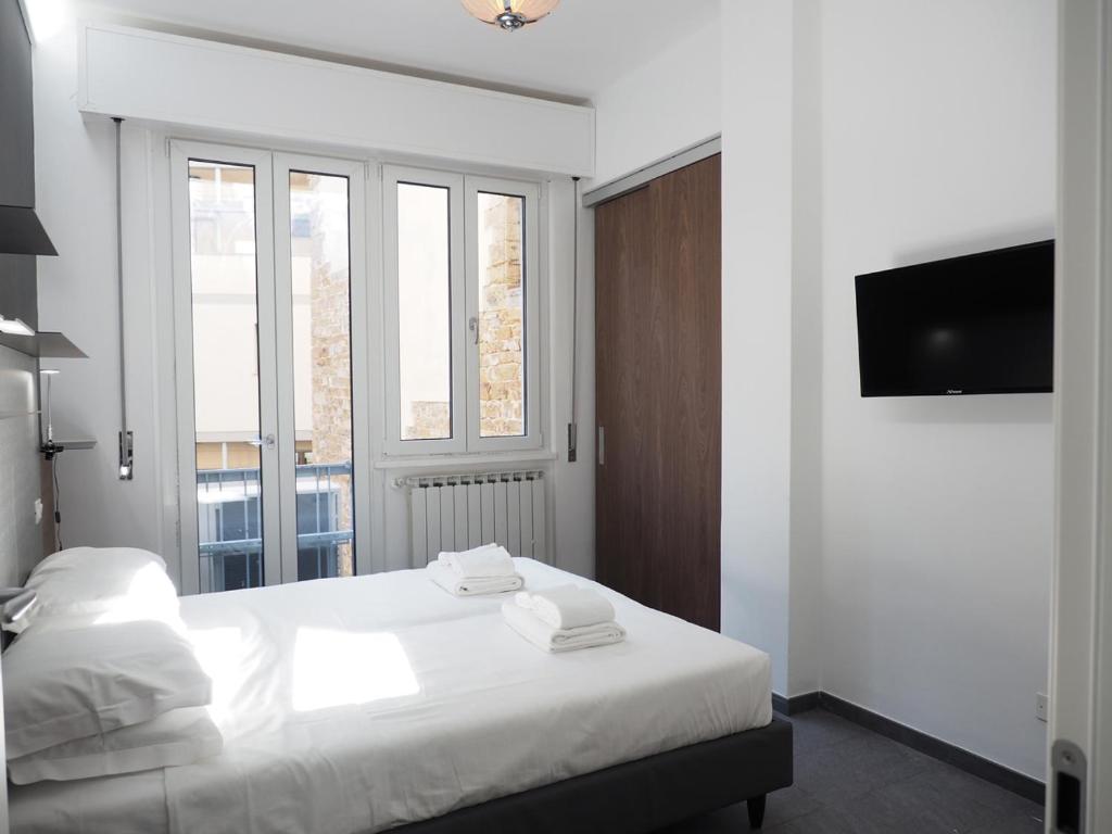 Łóżko lub łóżka w pokoju w obiekcie Pitti Apartment