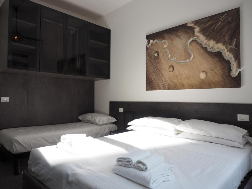 Łóżko lub łóżka w pokoju w obiekcie Pitti Apartment