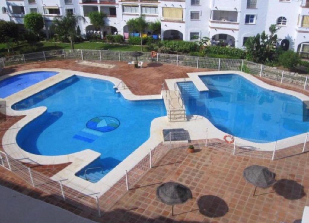 Bazén v ubytovaní M&J Benalmadena Retreat alebo v jeho blízkosti