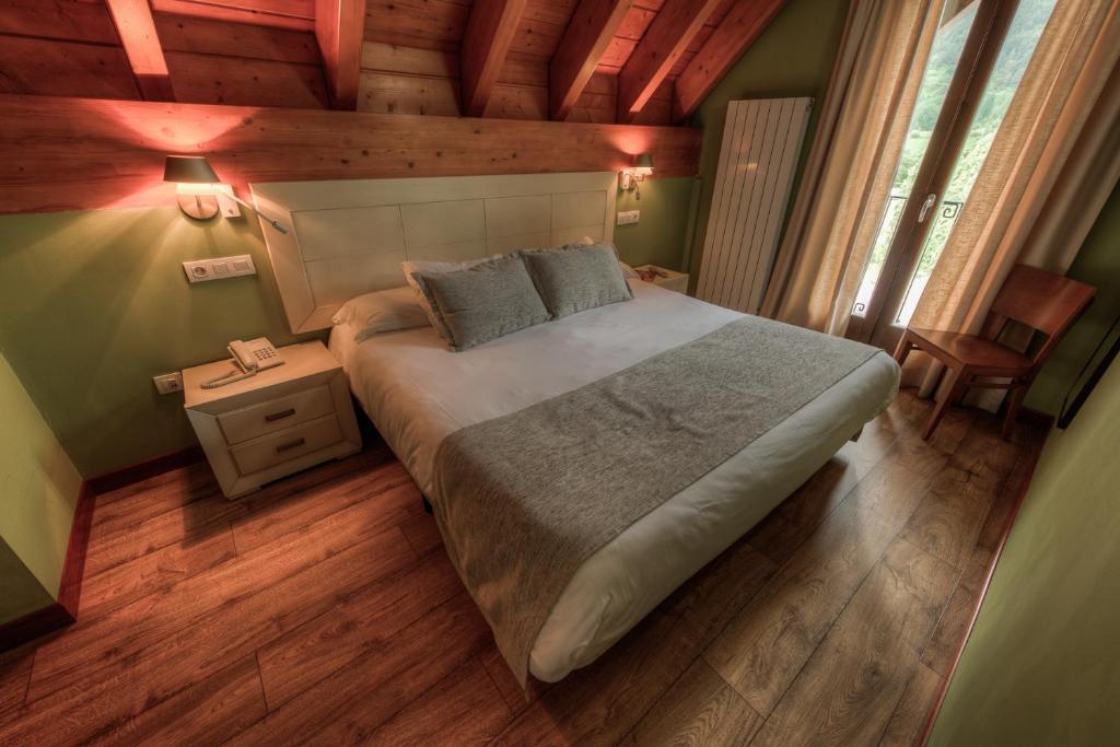 Postel nebo postele na pokoji v ubytování Apartahotel Tres Quiñones
