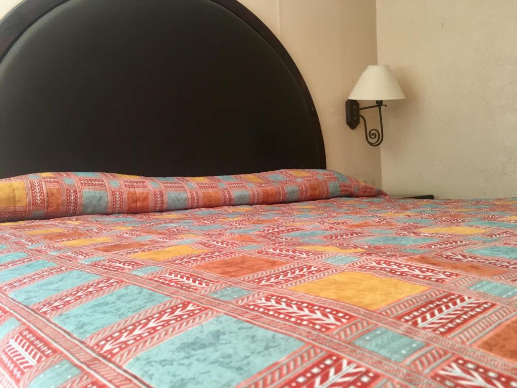 Postel nebo postele na pokoji v ubytování Hotel Acuario de Veracruz