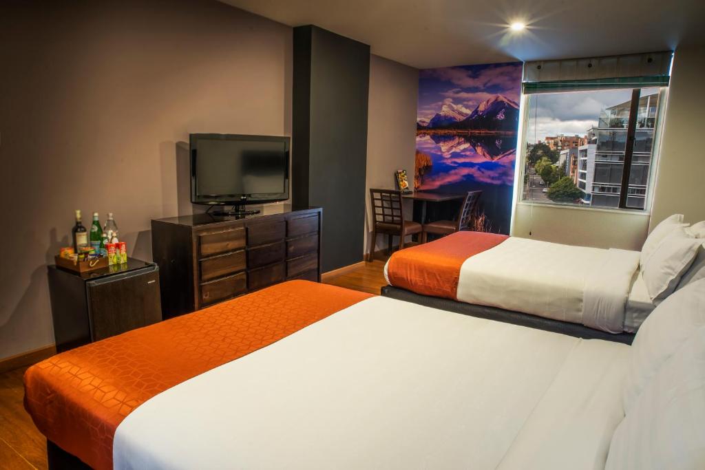 Postel nebo postele na pokoji v ubytování Hotel Santa Barbara Real