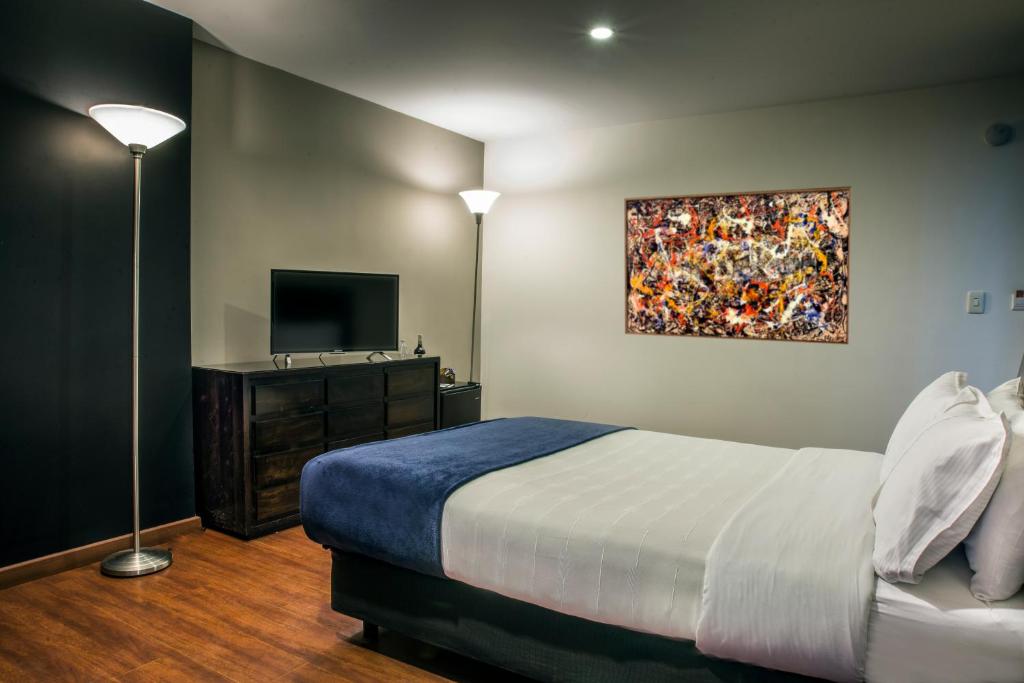 Postel nebo postele na pokoji v ubytování Hotel Santa Barbara Real