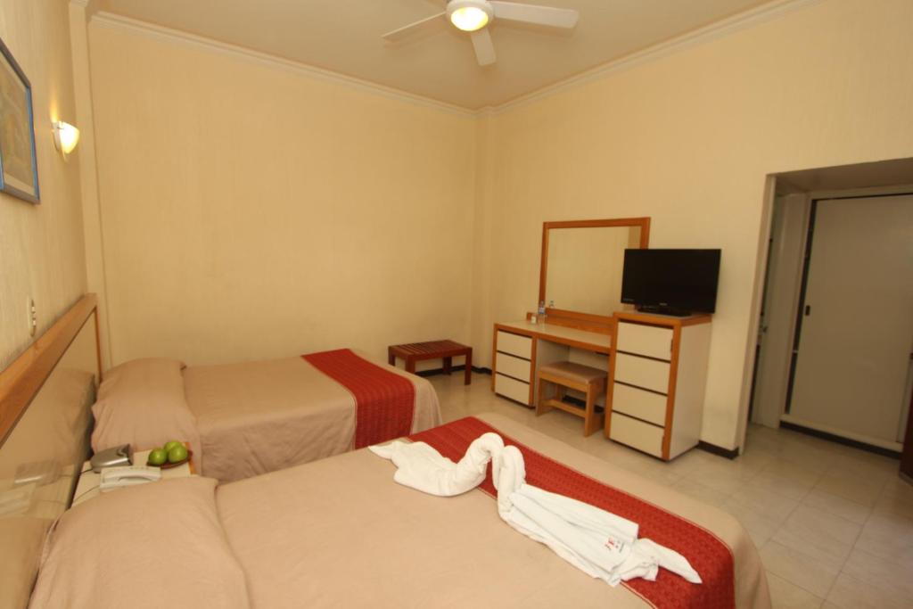 Postel nebo postele na pokoji v ubytování Hotel Ferri