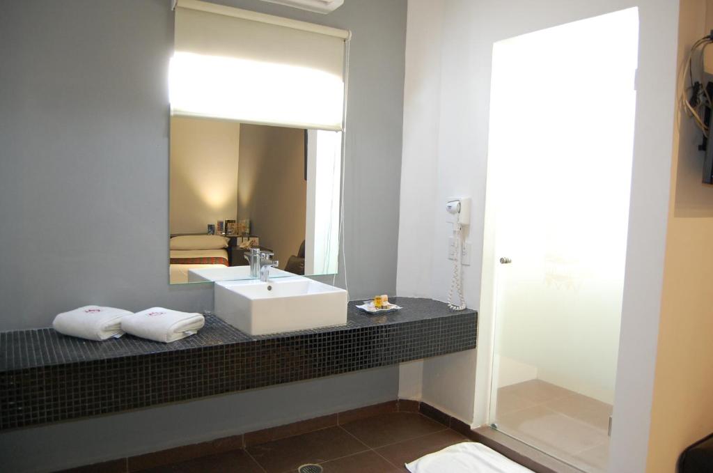 Postel nebo postele na pokoji v ubytování Hotel Dulce Boca