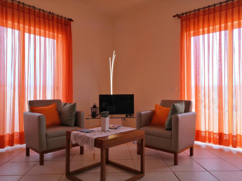 a living room with two chairs and a table at Sal Service Santana double bedrooms sea view angulo in Santa Maria
