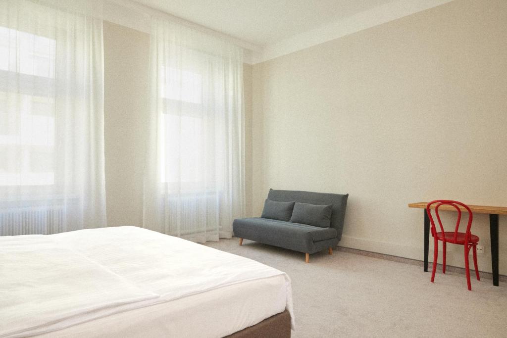 Llit o llits en una habitació de Hotel Babula am Augarten