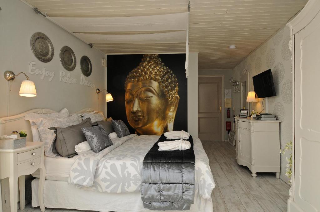 Postel nebo postele na pokoji v ubytování B&B de Valkenhorst