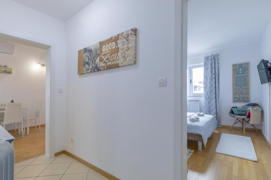Łóżko lub łóżka w pokoju w obiekcie Center Penthouse Apartment