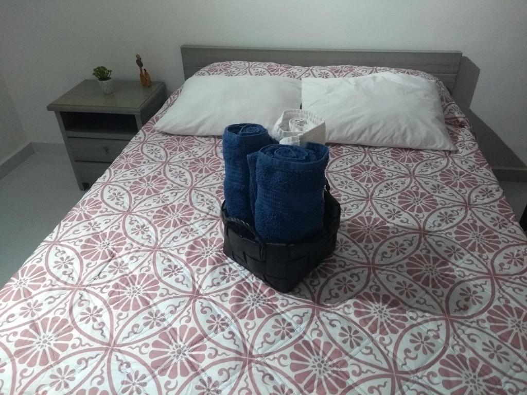 Postel nebo postele na pokoji v ubytování Acogedor apartamento en Girardot, fresco y tranquilo
