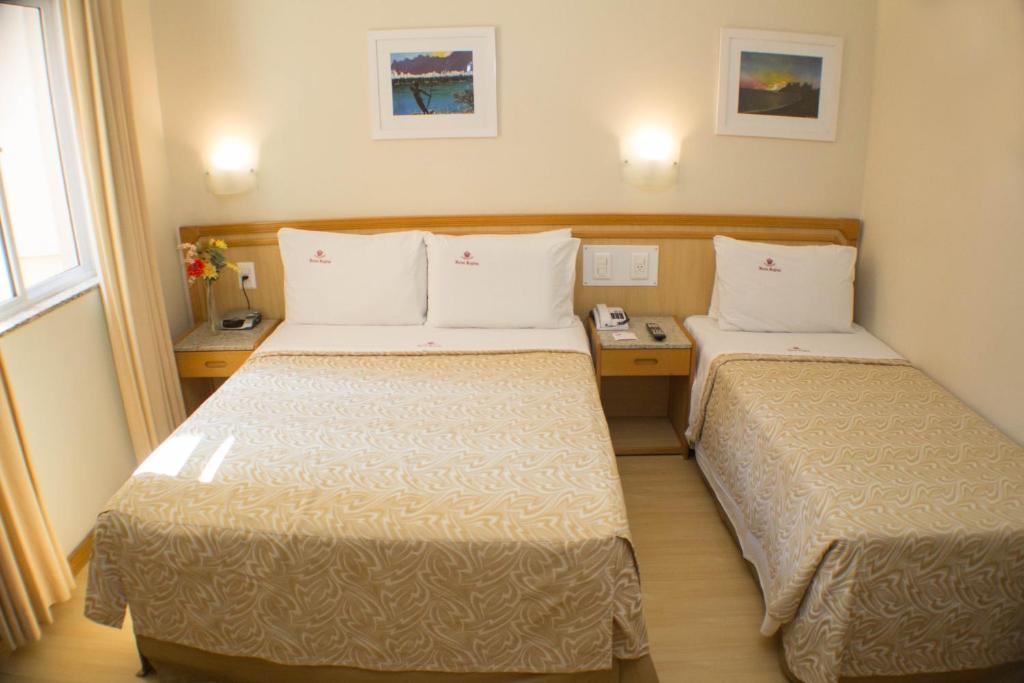 Postel nebo postele na pokoji v ubytování Hotel Regina Rio de Janeiro