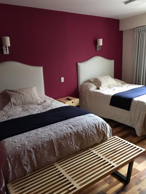 Postel nebo postele na pokoji v ubytování Anden Inca Hotel