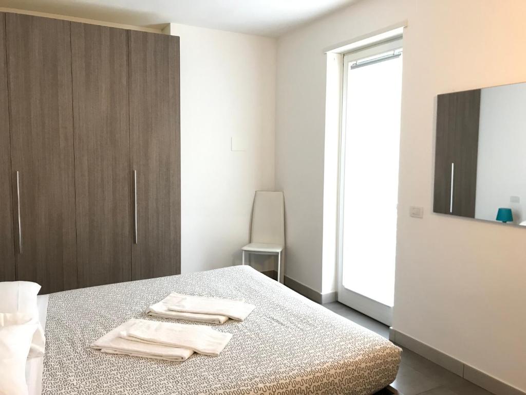 Postel nebo postele na pokoji v ubytování Camere e case vacanza Residenza Prealba