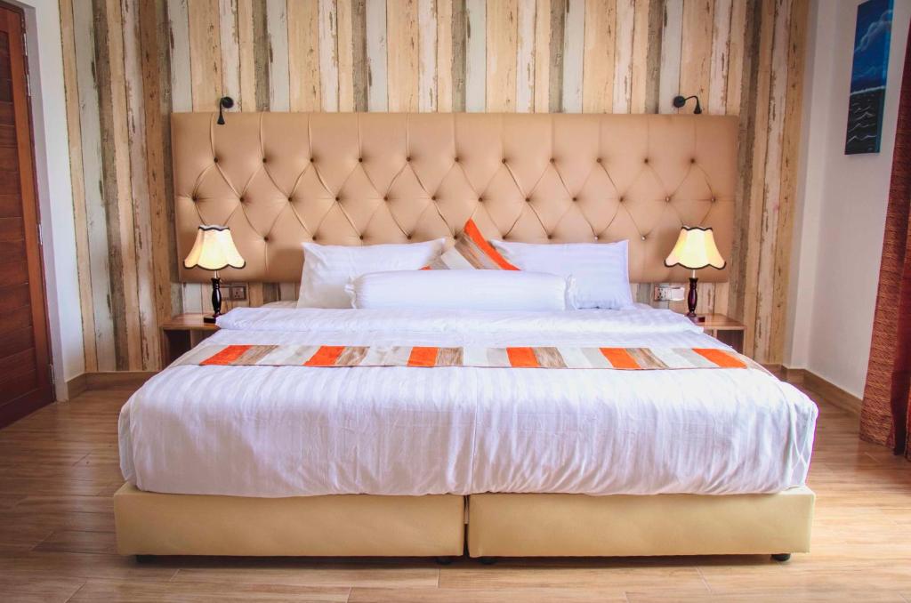 Postel nebo postele na pokoji v ubytování Rosy Villa Hotel
