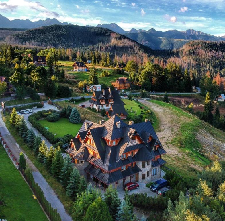 a small town with a large building and trees at Holiday Home Krzysztoforow in Zakopane