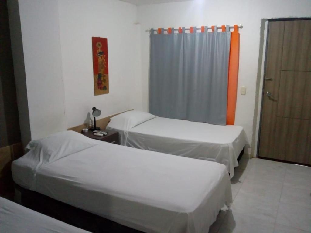 Postel nebo postele na pokoji v ubytování Manzanillo Beach