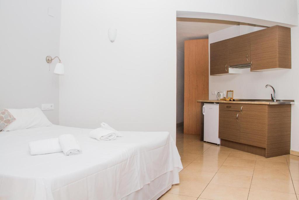 Postel nebo postele na pokoji v ubytování Hostal Gran Sol