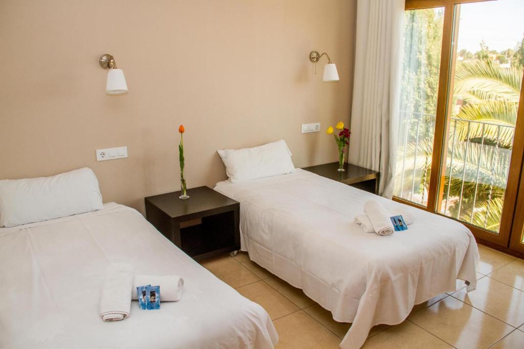Postel nebo postele na pokoji v ubytování Hostal Gran Sol