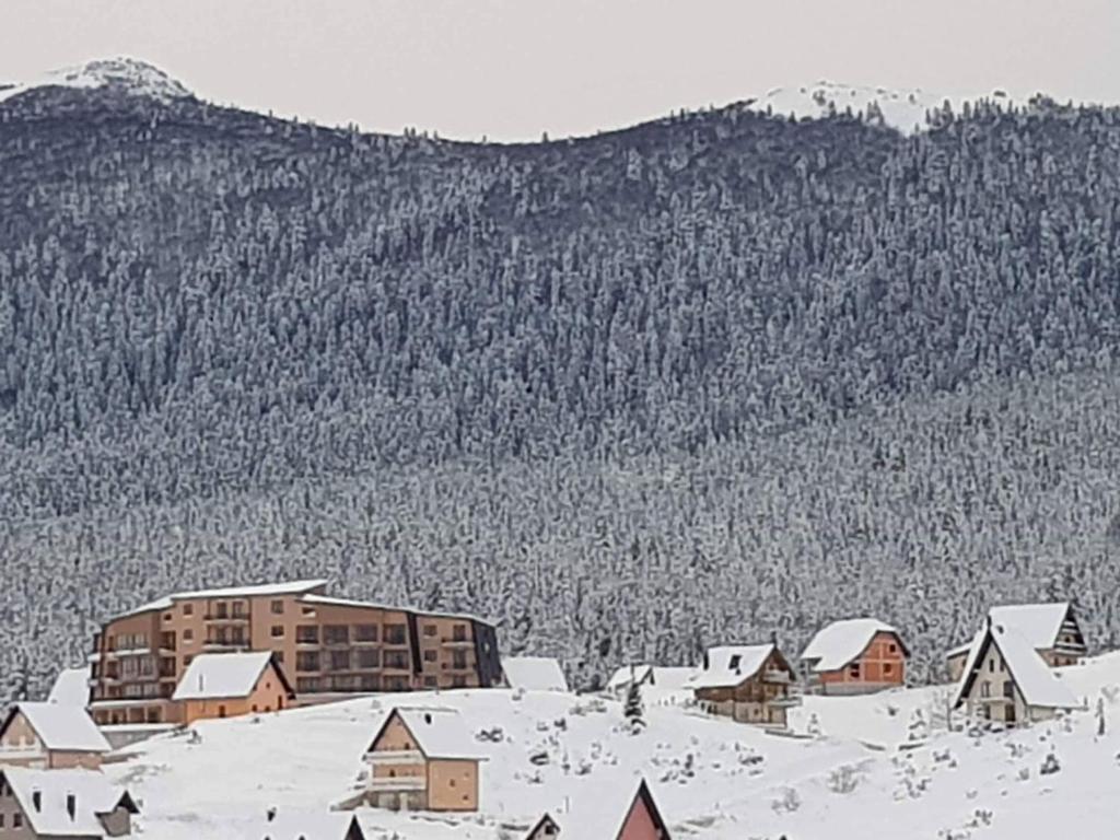 a drawing of a village in the snow at Apartman Panorama in Kupres