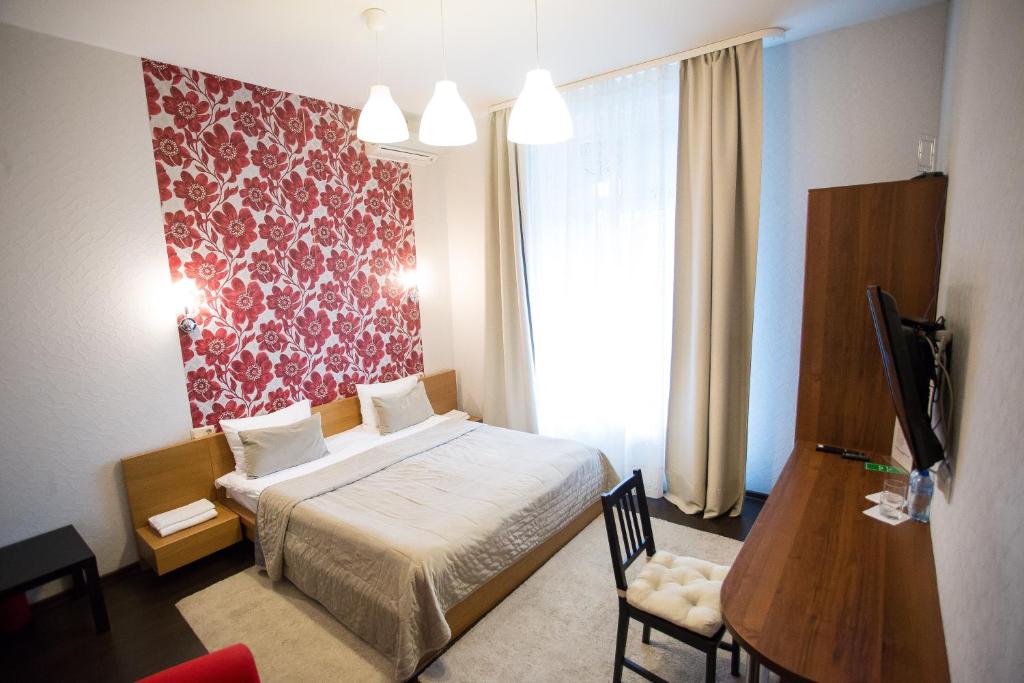 Cama ou camas em um quarto em Hotel Smolenka